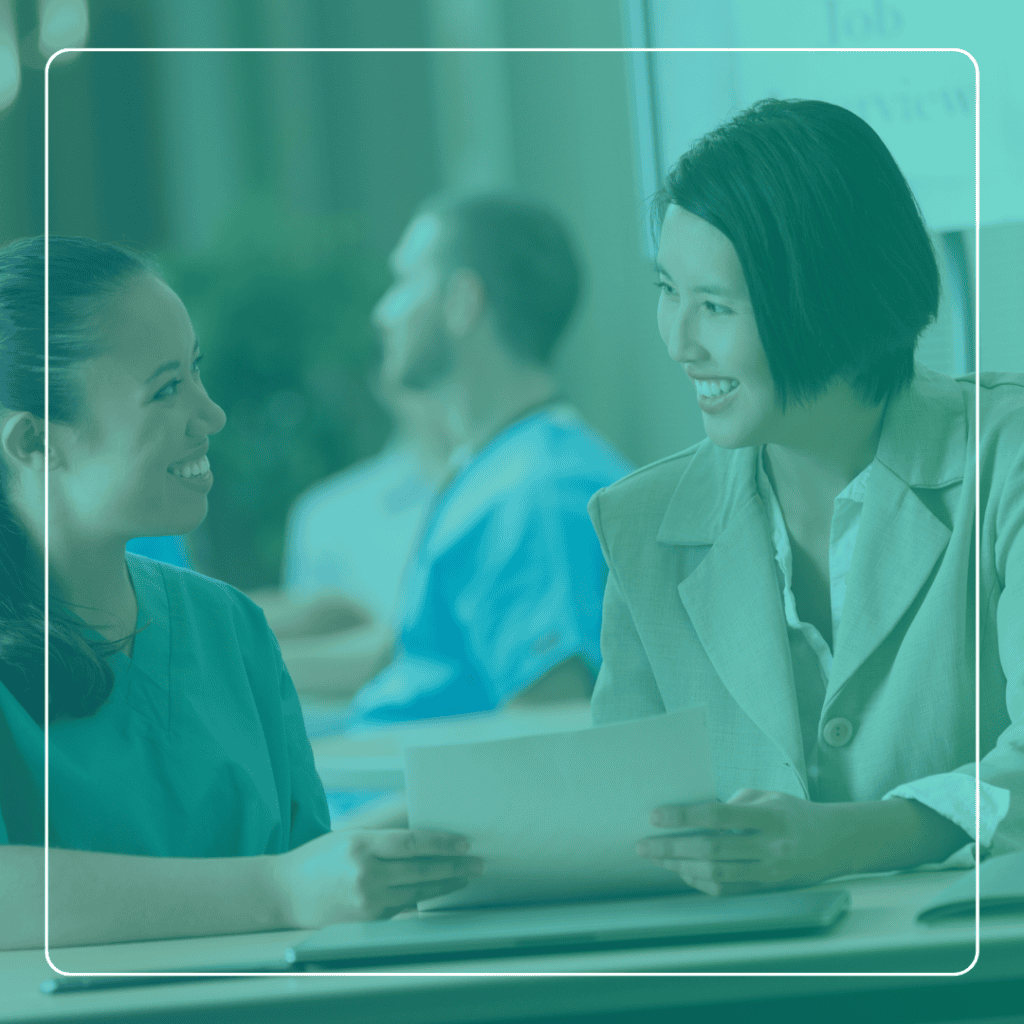 Two women discuss a job details during a job interview